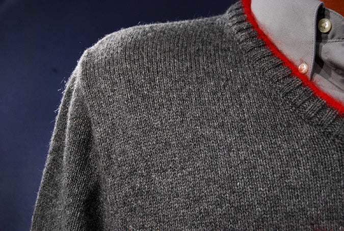 Men's Moschino Jeans grey V-neck sweater with red mohair trim and red navy chest stripes