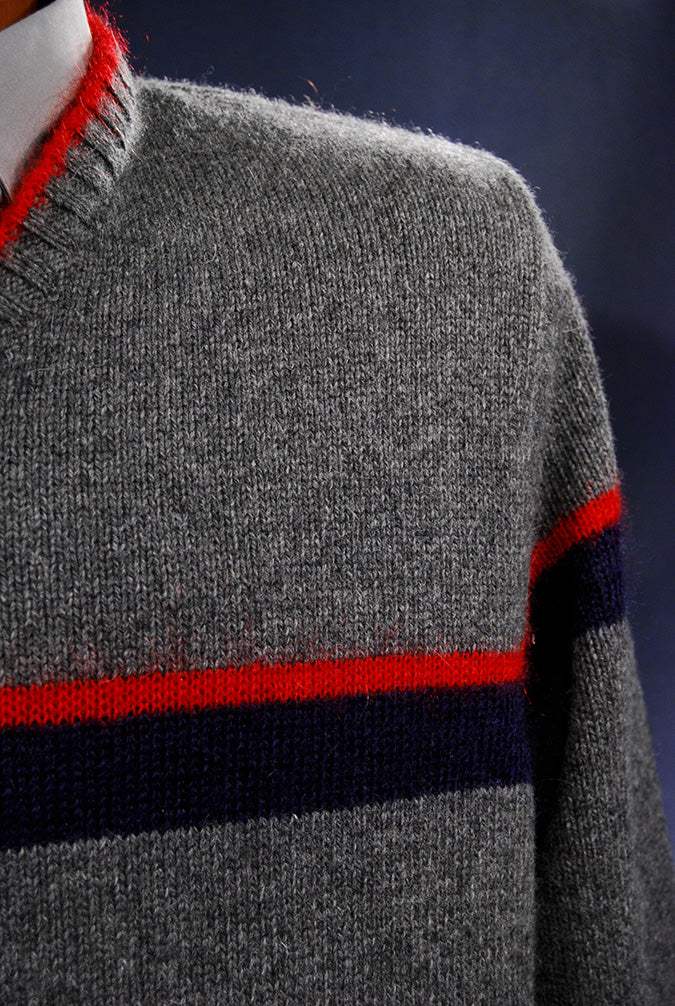 Grey Men's Moschino Jeans V-neck sweater with red mohair trim and red and navy chest stripes