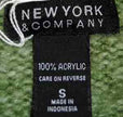 Close-up of a woman's sage-green V-neck sweater label from New York & Company, size small, made of 100% acrylic.