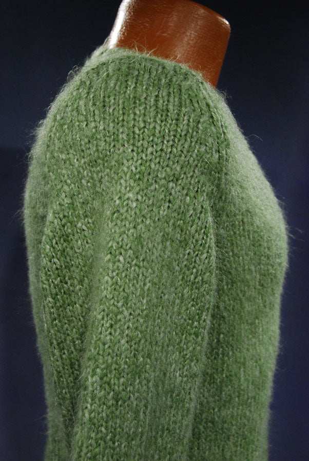 Woman's sage-green fuzzy V-neck sweater pullover in small-medium size displayed on mannequin