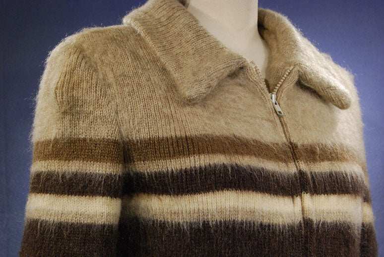 Woman's Icelandic wool coat with horizontal brown and cream stripes by Hilda Ltd, featuring a zipper and collar.