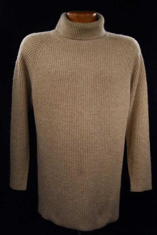 Woman wearing a medium tan angora ribbed turtleneck sweater by Principles