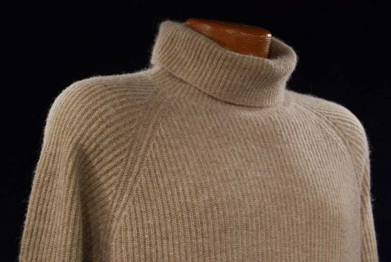 Woman wearing a medium tan angora ribbed turtleneck sweater by Principles