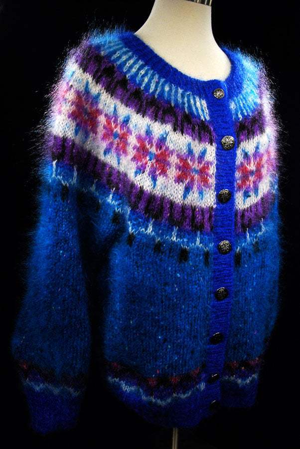 Colorful woman's mohair cardigan sweater by Icelandic design with metal buttons and vibrant patterns