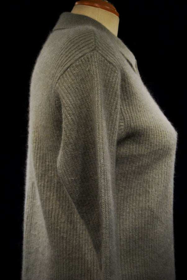Olive-green angora cardigan sweater with 3/4-length sleeves and lapels on mannequin