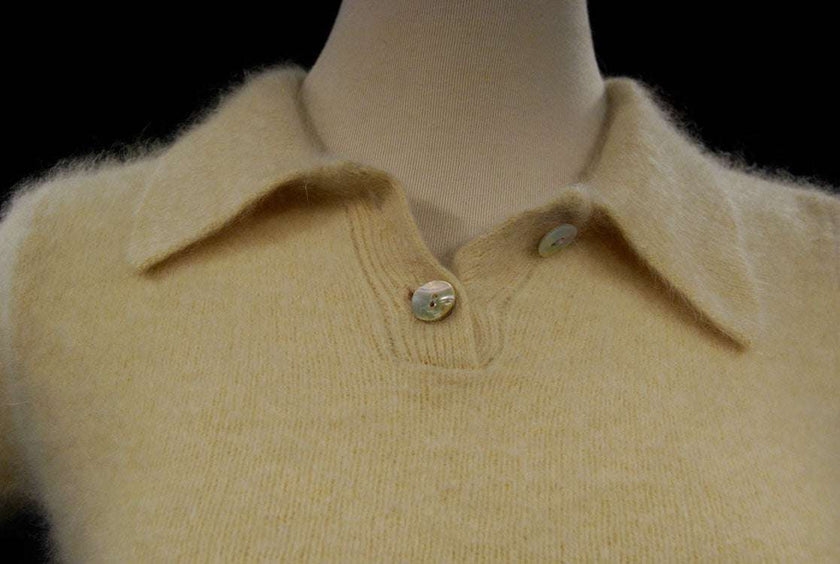 Woman wearing a cling-fit short-sleeve polo-neck angora sweater by Express