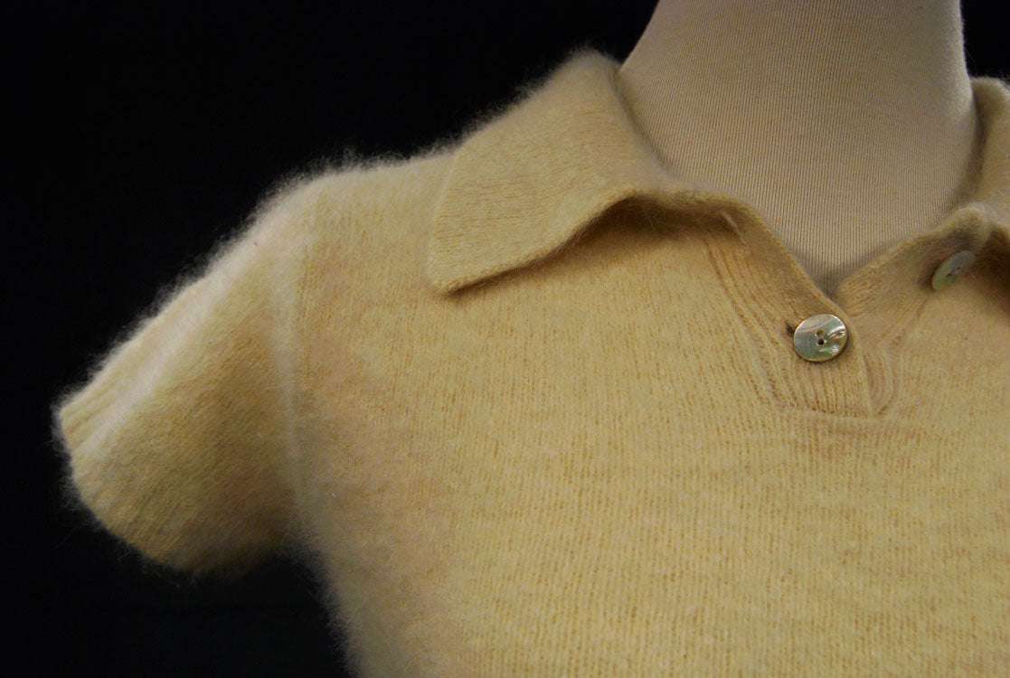 Woman wearing a soft cling-fit short-sleeve polo-neck angora sweater by Express