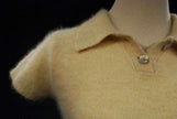 Woman wearing a soft cling-fit short-sleeve polo-neck angora sweater by Express