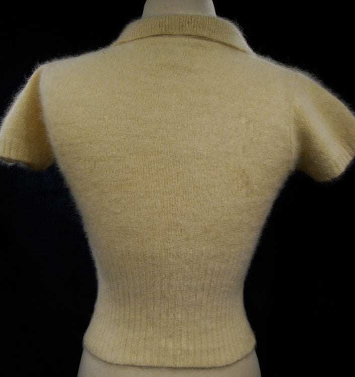 Woman wearing cling-fit short-sleeve polo-neck angora sweater by Express