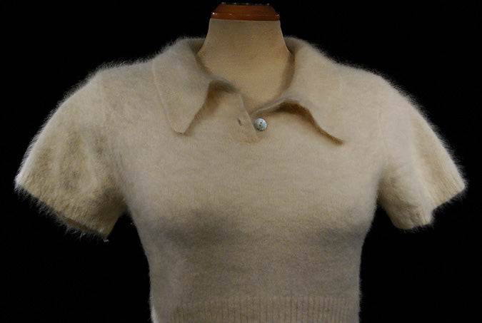Woman's short-sleeve polo-neck angora sweater by Express, cling-fit design with stretch