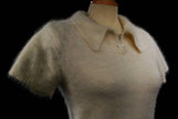 Woman wearing a cling-fit short-sleeve polo-neck angora sweater by Express