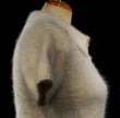 Woman wearing a soft short-sleeve polo-neck angora sweater by Express with a cling-fit design