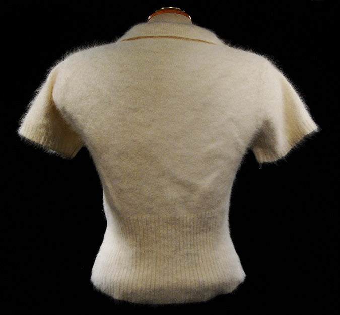 Woman's short-sleeve polo-neck angora sweater by Express, soft and cling-fit design