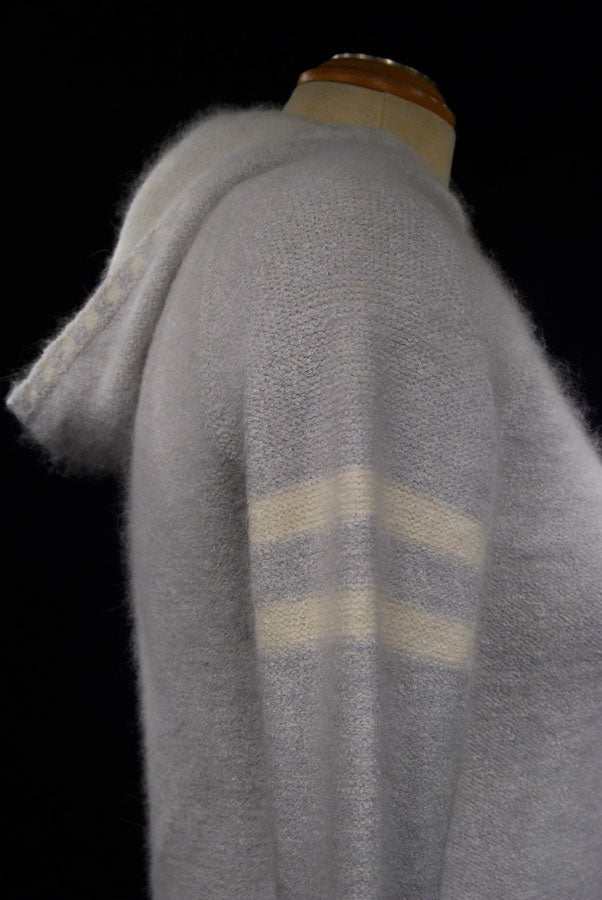 Girl's powder-blue angora sport jacket hoodie with white stripes on sleeve by Bebe Sports