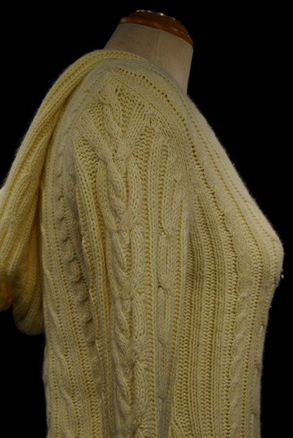 Girl's yellow cotton and angora V-neck cable knit sweater by Aeropostale on mannequin