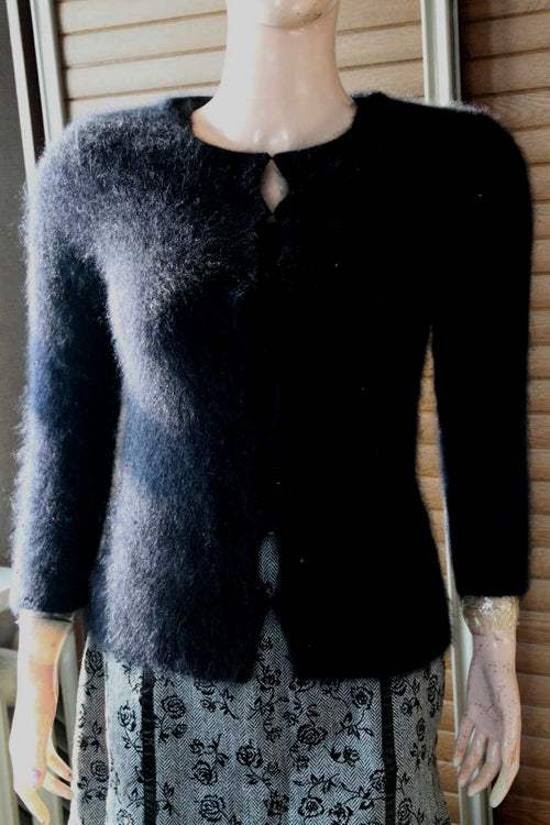 Women's black angora cardigan sweater with hook and loop closures, size XX-Small, displayed on mannequin