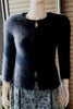Women's black angora cardigan sweater with hook and loop closures, size XX-Small, displayed on mannequin