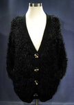 Black woman's eyelash cardigan sweater with long fuzzy acrylic fibers and four buttons on mannequin