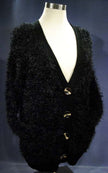 Black woman's eyelash cardigan sweater with long fuzzy acrylic fibers and four buttons