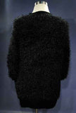 Black woman's eyelash cardigan sweater with fuzzy acrylic fibers and front pockets on mannequin