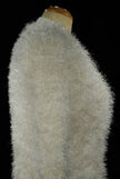 Woman's eyelash cardigan sweater in light gray fuzzy acrylic fibers with four buttons and front pockets displayed on mannequin.