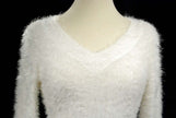 Woman's white ultra-soft fuzzy V-neck pullover sweater with cling fit and extra-long design