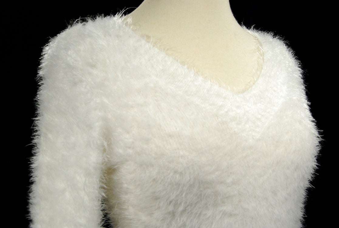 Woman's white ultra-soft fuzzy V-neck pullover sweater with long fit and stretchy cling design
