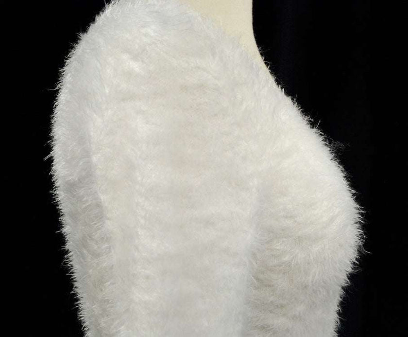 Woman's white ultra-soft fuzzy V-neck sweater with cling fit and extra-long design