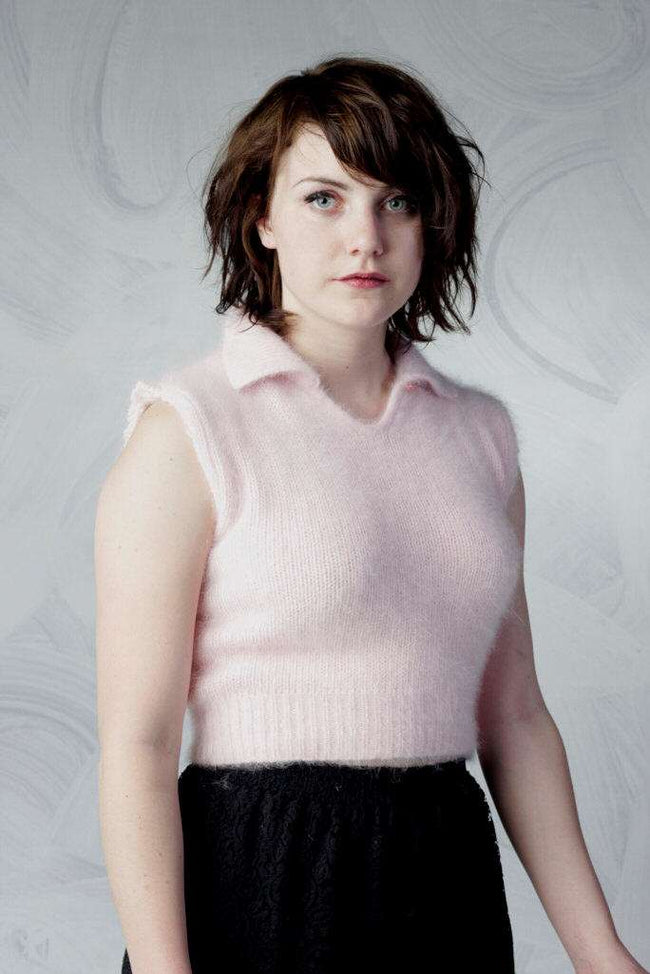 Woman wearing a pink angora cropped sleeveless polo-neck sweater by Moda Intl