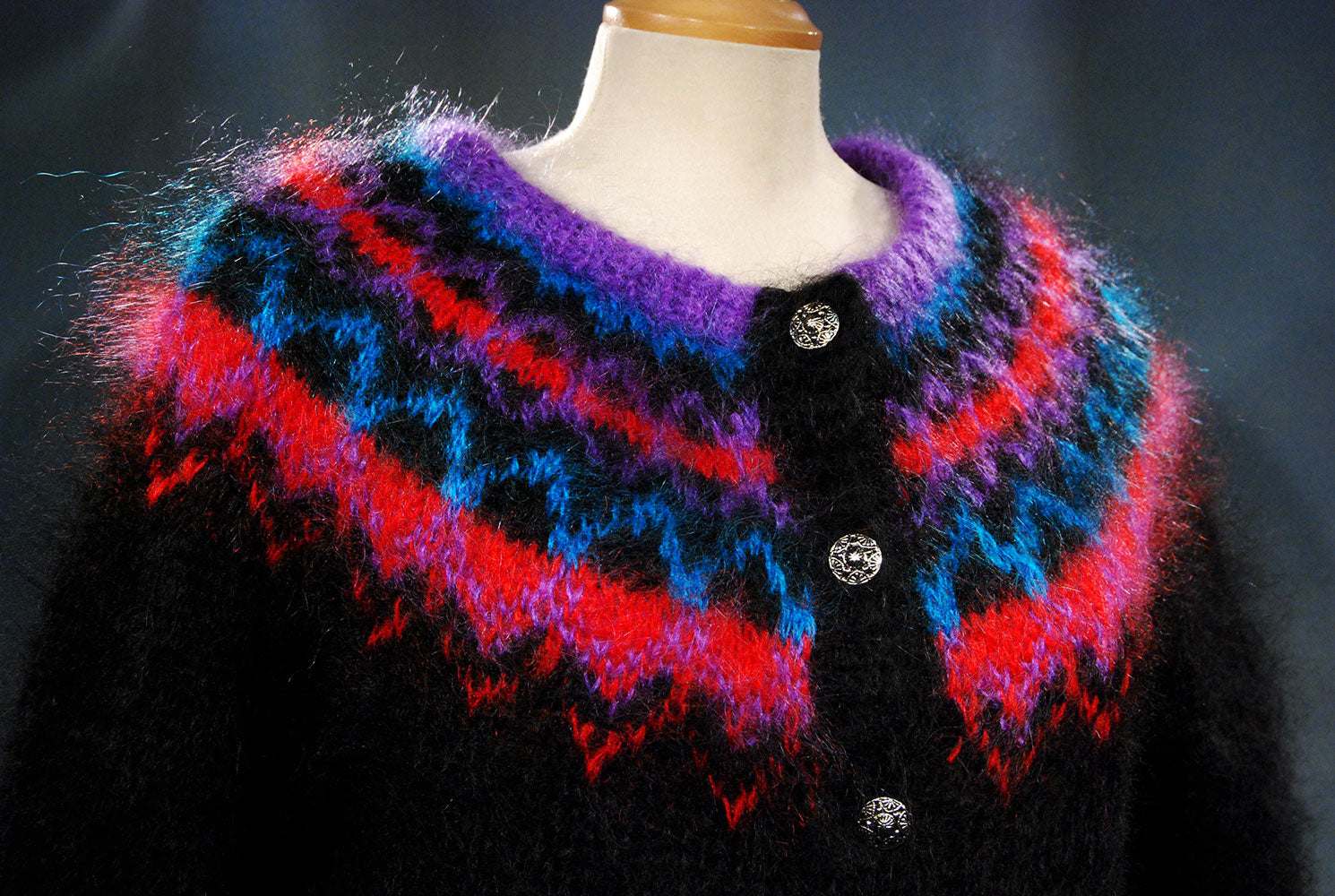 Colorful woman's mohair cardigan sweater with metal buttons and vibrant Icelandic design pattern