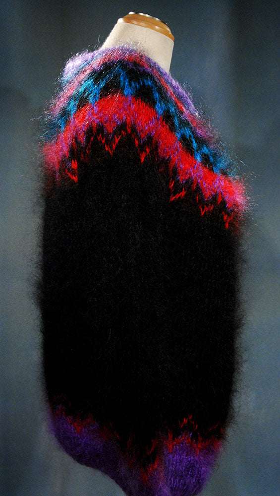 Colorful woman's mohair cardigan sweater with Icelandic design and vibrant patterns on black background
