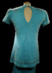 Woman's two-piece matching aqua angora sweaterdress outfit with rhinestone and sequin embellishments, keyhole back neckline, and short sleeves.