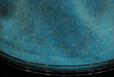 Close-up of aqua angora sweater skirt hem with rhinestone trim from woman's two-piece matching outfit