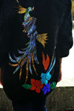 Woman's black angora cardigan sweater with large colorful peacock design on back in plus size 2X