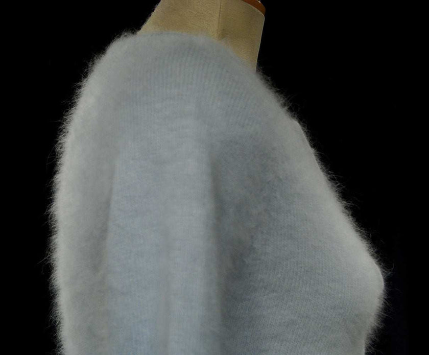 Powder blue woman's angora tie-neck sweater with blue-grey stripes and neck cord by Xhilaration