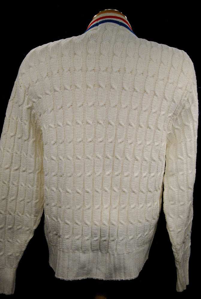 White retro cable-knit tennis sweater with red and blue trim stripes, women's cardigan by Orlon Sayelle, size small