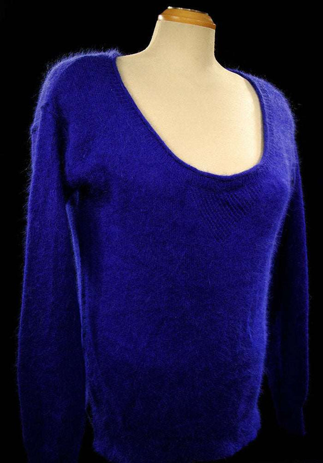 Woman wearing royal blue angora scoop-neck sweater by Victoria's Secret in size Small-Medium