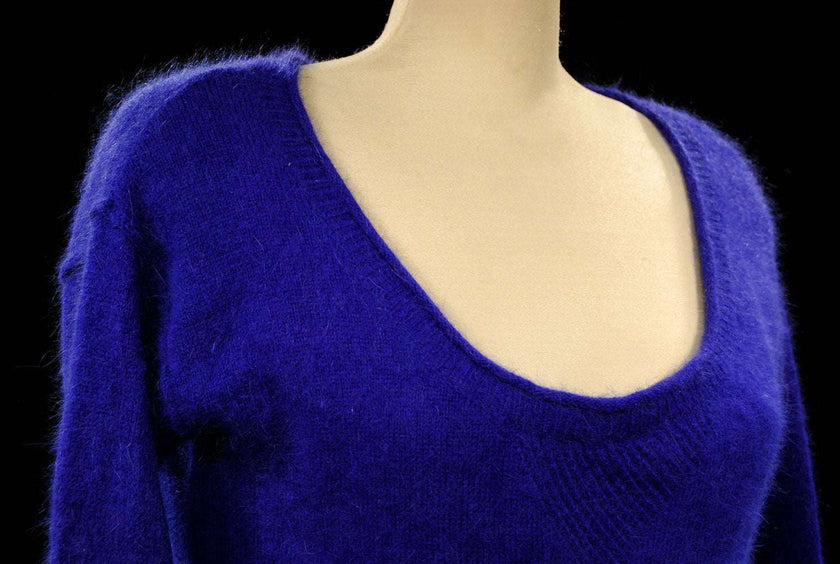 Woman wearing royal blue angora scoop-neck sweater by Victoria's Secret small-medium size