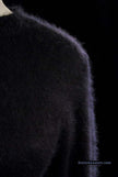 Woman's black angora crewneck sweater by Express Tricot in close-up texture view