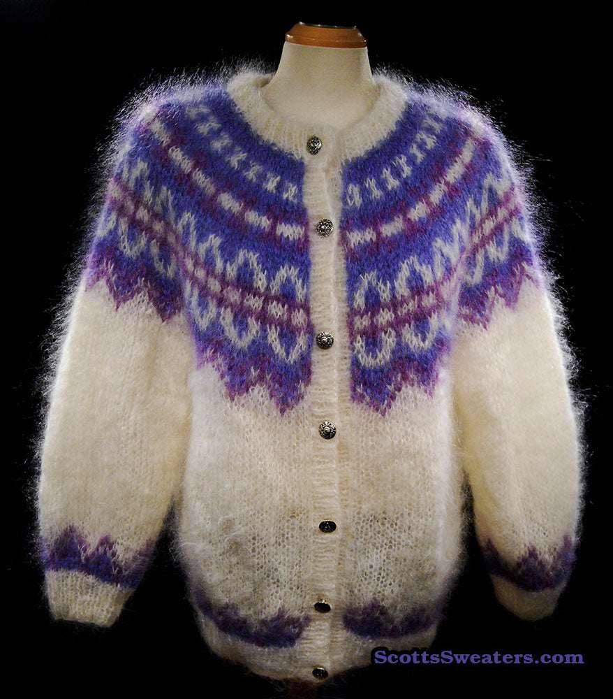 Colorful woman's mohair cardigan sweater with Icelandic design and metal buttons on mannequin