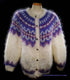 Colorful woman's mohair cardigan sweater with Icelandic design and metal buttons on mannequin