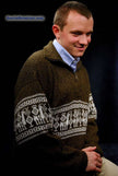 Golden-brown men's alpaca zipper polo-neck sweater with white Aztec design and hand warmer pocket, medium size