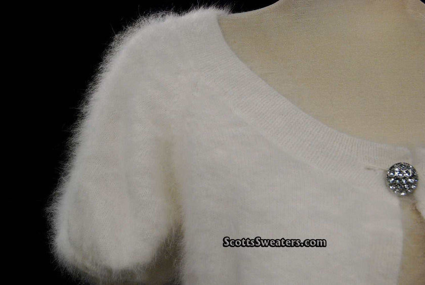 White woman's angora shrug cardigan sweater with jeweled rhinestone button by Express