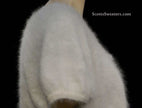 White woman's angora shrug cardigan sweater with jeweled rhinestone button by Express