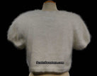 White woman's angora shrug cardigan sweater with short sleeves and soft fluffy texture