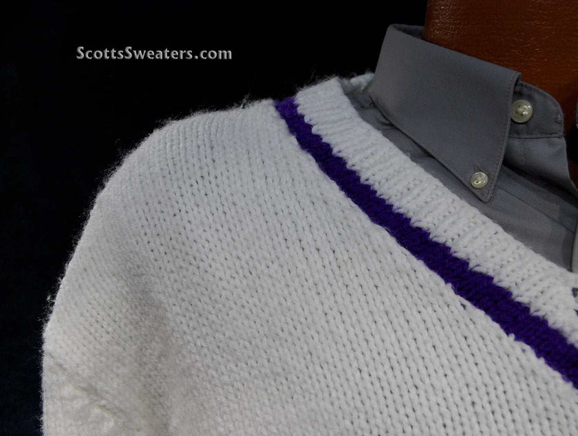 White hand-knit men's V-neck tennis sweater with purple stripe on neck, waist, and cuffs, size 2XL