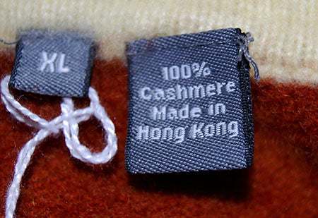 Men's cashmere sweater size XL tag made in Hong Kong close-up