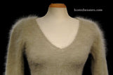 Woman wearing tan woman's angora scoop neck sweater with cling-fit design by Banana Republic