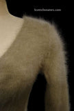 Woman wearing a tan Woman's Angora Scoop Neck Sweater by Banana Republic with cling-fit design