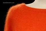 Woman's orange jewel-neck soft fuzzy angora sweater by H&M in size medium